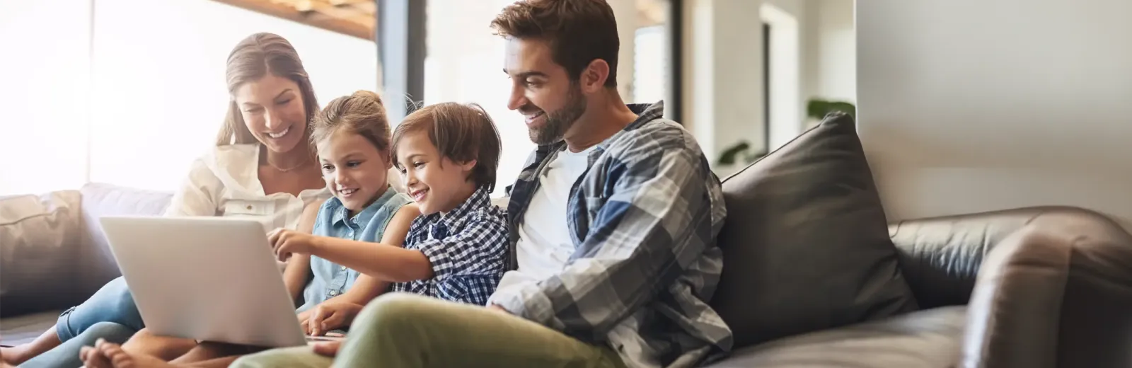 family playing on computer in pest free home